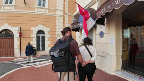 Monaco City, Monaco – July 18, 2025: Tourists strolling along the scenic pedestrian path on a charming narrow street in the city - Starpik Stock