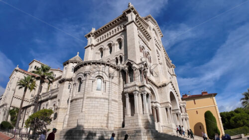 Monaco City, Monaco – July 18, 2025: View of the facade of the Cathedral of Our Lady Immaculate under the blue sky - Starpik Stock