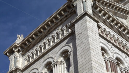 Monaco City, Monaco – July 4, 2025: View of the facade of the Cathedral of Our Lady Immaculate under the blue sky - Starpik Stock