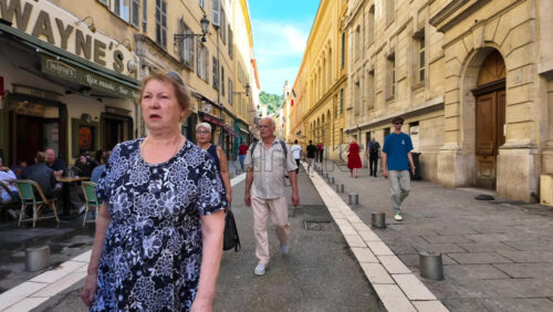 Nice, France – August 15 2025: Narrow old town street with colourful buildings, people walking, and relaxed atmosphere - Starpik Stock