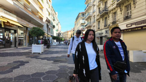 Nice, France – August 15 2025: Pedestrian street lined with shops and restaurants, including people dining outdoors - Starpik Stock