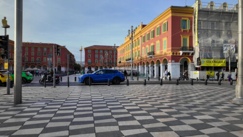 Nice, France – July 19, 2025: Cars moving near Place Massena in daylight - Starpik Stock