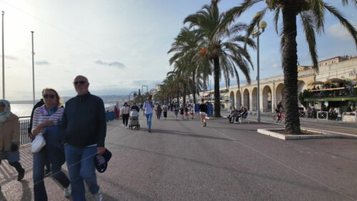 Nice, France – July 20, 2025: People walking on Promenade de Anglais on a sunny day near the coastline - Starpik Stock