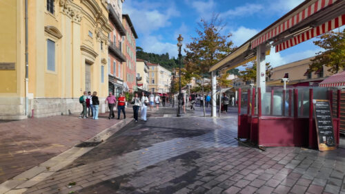 Nice, France – July 20, 2025: People walking on the streets of the city on a sunny day - Starpik Stock