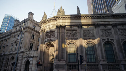 Ornate historic building with Corinthian columns and statues in London’s financial district - Starpik Stock