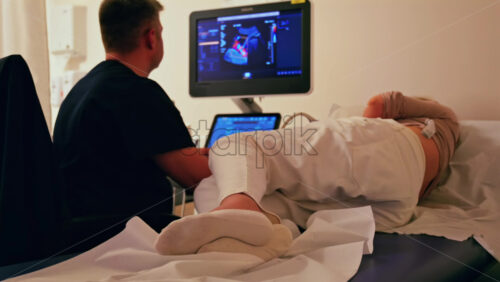 Pregnant woman undergoing an ultrasonography at a doctor’s office - Starpik Stock