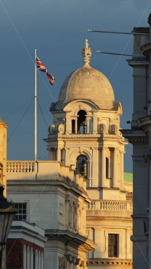 Scenic view of classic streets featuring historic white stone buildings in London, England. Vertical - Starpik Stock