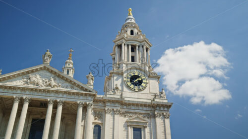 The St. Paul’s Cathedral with a clear blue sky in the background in London, England - Starpik Stock