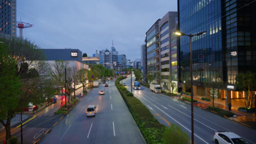 Tokyo, Japan – April 13, 2025: High angle view of cars moving on the streets of the city in the evening - Starpik Stock