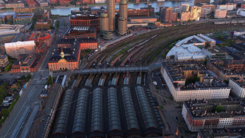 Video – Aerial drone view of the Copenhagen Central Railway Station in the evening - Starpik Stock