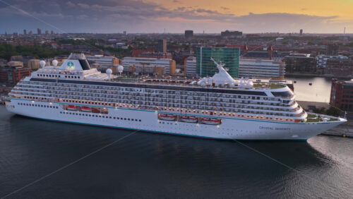 Video – Copenhagen, Denmark – August 3, 2025: Aerial drone view of a cruise ship docked in Copenhagen harbor near Langelinie - Starpik Stock