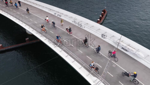 Video – Copenhagen, Denmark – August 4, 2025: Aerial drone view of Langebro Bridge with its green copper tower and views of Kalvebod Brygge promenade in daylight - Starpik Stock