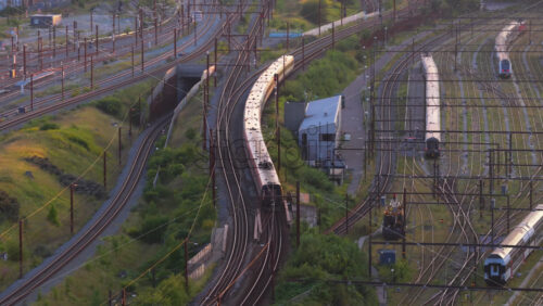 Video – Copenhagen, Denmark – August 4, 2025: Aerial drone view of intercity trains and S-trains in the rail yard near Copenhagen Central Station - Starpik Stock
