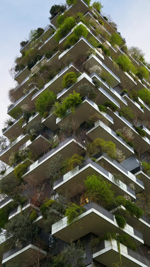 Video – Milan, Italy – March 21, 2025: Low angle view of the Vertical Forest residential complex in the Porta Nuova district. Vertical - Starpik Stock