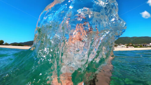Video – Smiling woman is frolicking in the water of the Aegean sea, nature on the background. Slow motion. Greece - Starpik Stock
