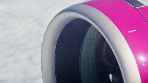 View of a turbine rotating from an airplane window - Starpik Stock