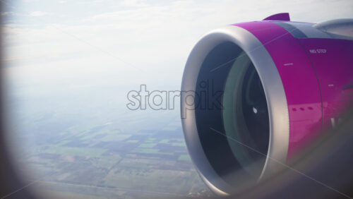 View of a turbine rotating from an airplane window - Starpik Stock