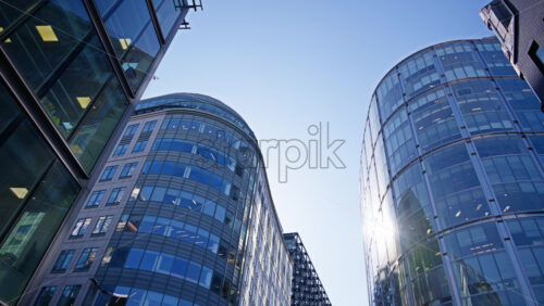 View of modern glass office buildings in London, England with sunlight reflecting off windows. Primrose Street - Starpik Stock