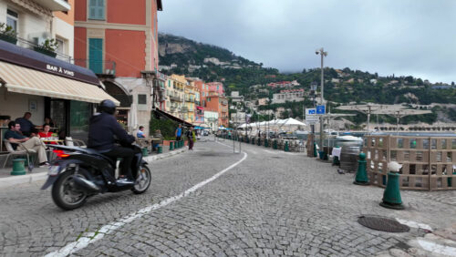 Villefranche-sur-Mer, France – July 18, 2025: View of the streets of the city lined with colourful buildings - Starpik Stock