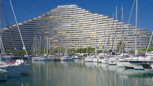 Villeneuve-Loubet, France – June 7, 2025: Boats docked in the Marina Baie des Anges in daylight - Starpik Stock