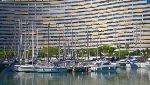 Villeneuve-Loubet, France – June 7, 2025: Boats docked in the Marina Baie des Anges in daylight - Starpik Stock