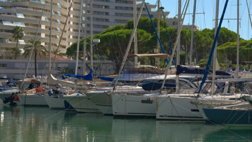 Villeneuve-Loubet, France – June 7, 2025: Boats docked in the Marina Baie des Anges in daylight - Starpik Stock