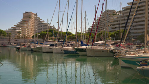 Villeneuve-Loubet, France – June 7, 2025: Boats docked in the Marina Baie des Anges in daylight - Starpik Stock