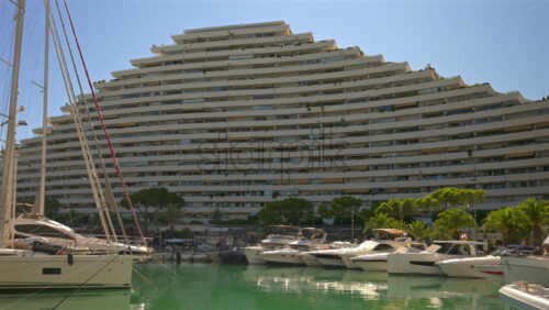 Villeneuve-Loubet, France – June 7, 2025: Boats docked in the Marina Baie des Anges in daylight - Starpik Stock