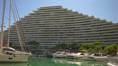 Villeneuve-Loubet, France – June 7, 2025: Boats docked in the Marina Baie des Anges in daylight - Starpik Stock