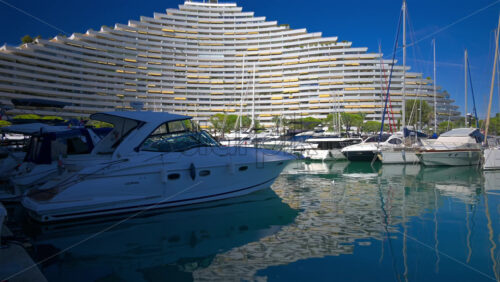 Villeneuve-Loubet, France – June 7, 2025: Boats docked in the Marina Baie des Anges in daylight - Starpik Stock