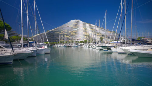 Villeneuve-Loubet, France – June 7, 2025: Boats docked in the Marina Baie des Anges in daylight - Starpik Stock
