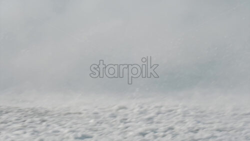 Water being splashed around by a jet ski moving at high speed across a calm body of water - Starpik Stock
