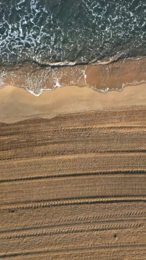 Waves of the Mediterranean Sea hitting the shore in Alicante, Spain. Vertical - Starpik Stock