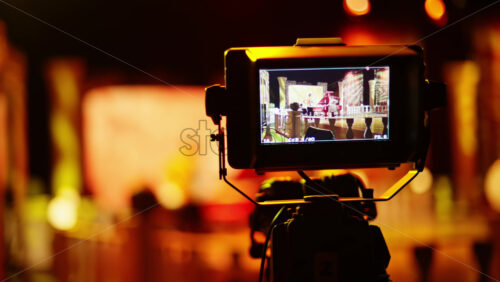 Video - Professional camera filming with on the backstage of a TV set