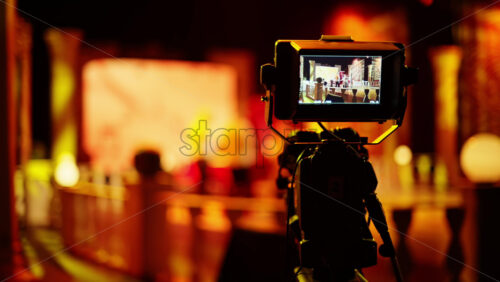 Video - Professional camera filming with on the backstage of a TV set