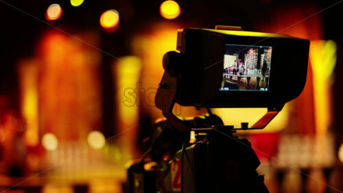 Video - Professional camera filming with on the backstage of a TV set