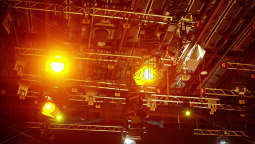 Video - Flashing studio lights equipment on the ceiling of a TV set