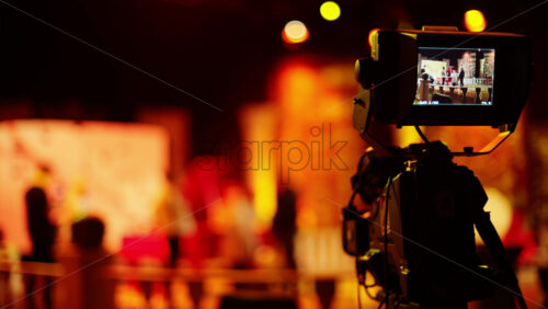 Video - Professional camera filming with on the backstage of a TV set