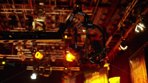 Video - Chisinau, Moldova - March 29, 2024: Camera equipment and flashing studio lights on the ceiling of a TV set
