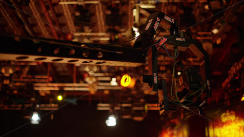 Video - Chisinau, Moldova - March 29, 2024: Camera equipment and flashing studio lights on the ceiling of a TV set