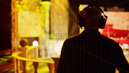 Video - Chisinau, Moldova - March 29, 2024: Man filming with professional camera on the backstage of a TV set