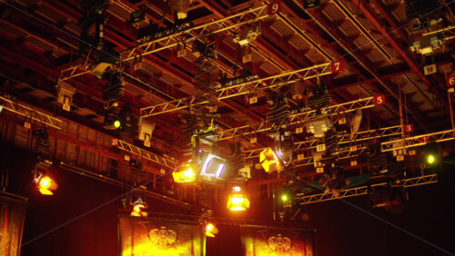 Video - Flashing studio lights equipment on the ceiling of a TV set
