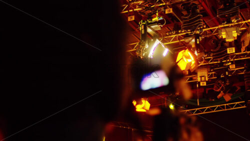 Video - Man filming with professional camera on the backstage of a TV set