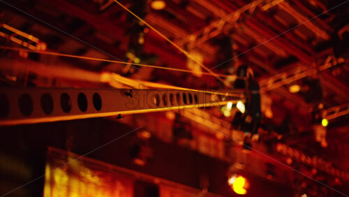 Video - Chisinau, Moldova - March 29, 2024: Professional long camera filming and flashing studio lights on the ceiling of a TV set