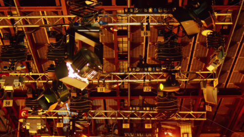 Video - Flashing studio lights equipment on the ceiling of a TV set