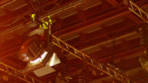Video - Flashing studio lights equipment on the ceiling of a TV set