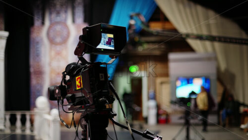 Video - Professional camera filming with on the backstage of a TV set