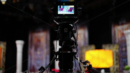 Video - Professional camera filming with on the backstage of a TV set