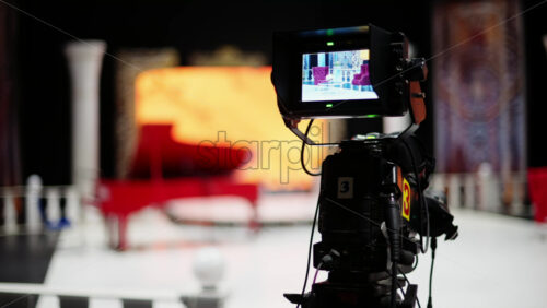 Video - Professional camera filming with on the backstage of a TV set