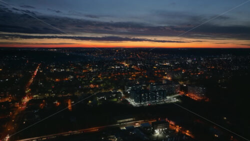 Video - Aerial drone view of Chisinau city at night, blue hour. Moldova